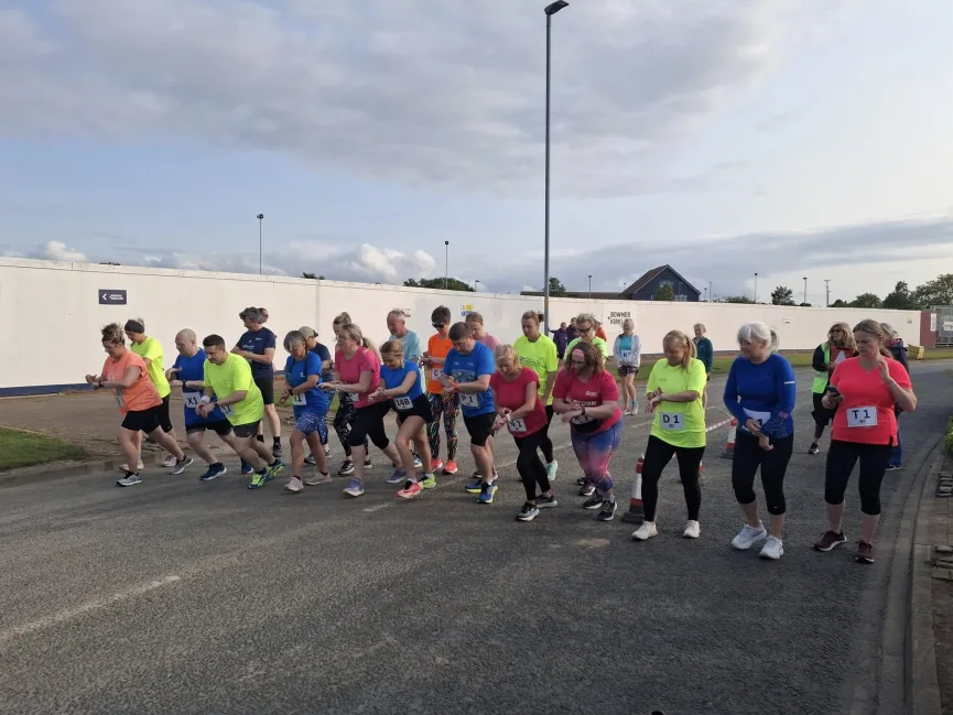 Runners competing in a relay race
